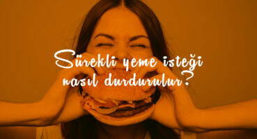 Caucasian woman eating cheeseburger